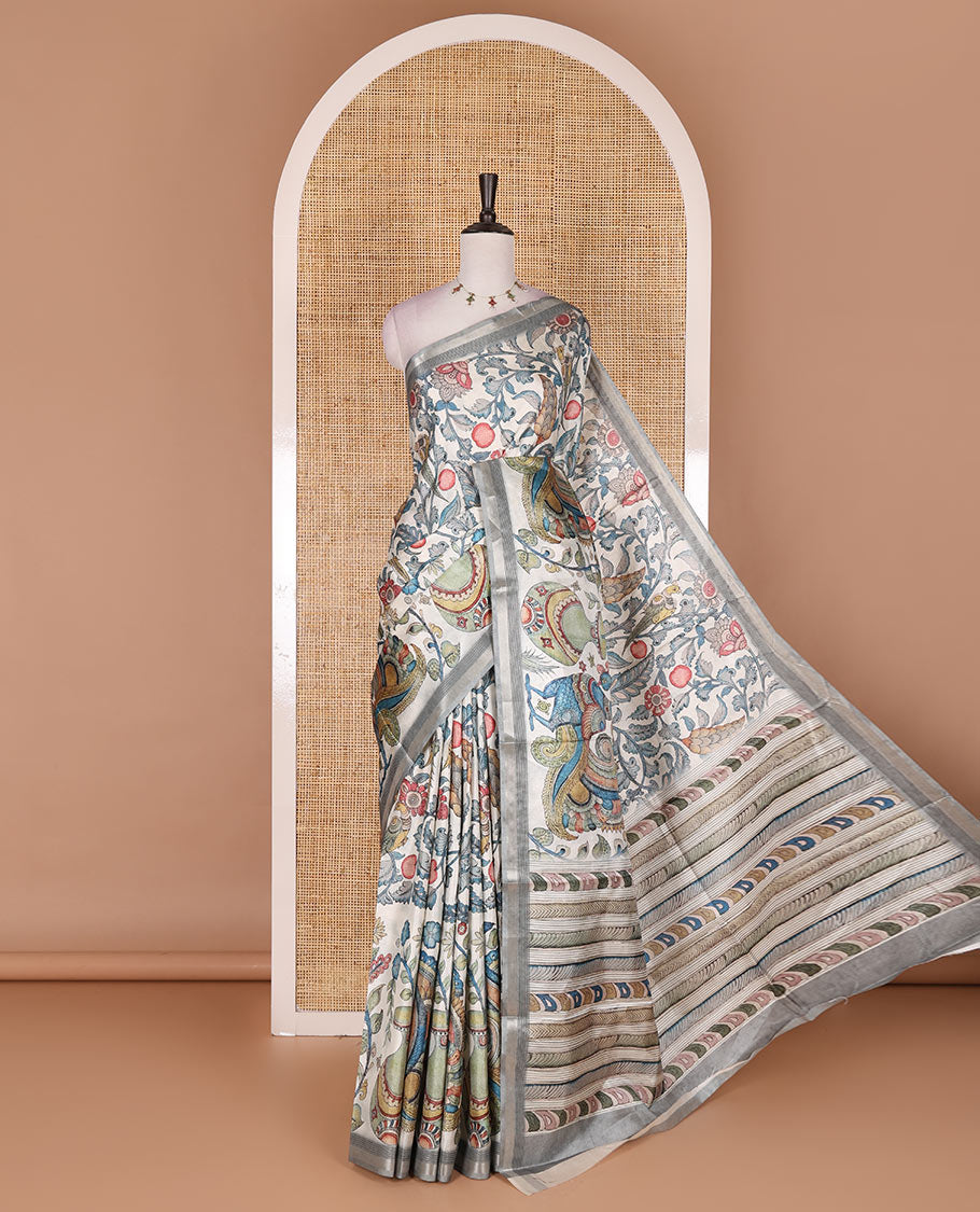 Cream-base multi-color kalamkari floral-vine and peacocks printed semi-tussar saree, gold zari piping border, kalamkari printed pallu, and contrast printed blouse