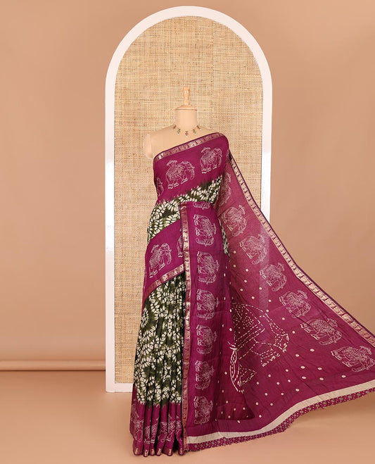 Green shibori printed muslin cotton saree, contrast zari border of elephant motifs print, big elephant printed pallu, and a contrast printed blouse