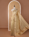 Cream full-plain tissue silk saree, zari bavanji border of thilakam mokku, zari pallu & running self-color blouse