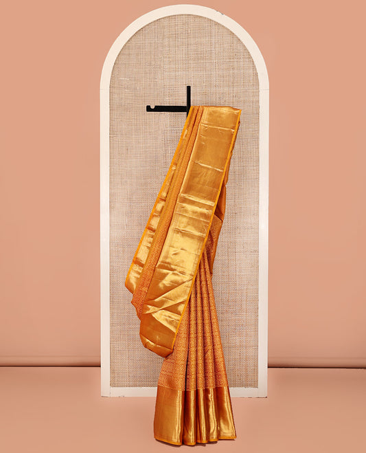 Gold Kanchipuram Wedding Silk Saree, Richly Detailed with Jacquard Design On Its Body, Highlighted by Zari Border of Rekku, Poun, Kodi Visiry, and Diamond Designs, Grand Jaal Pallu and Paired with a Matching Blouse