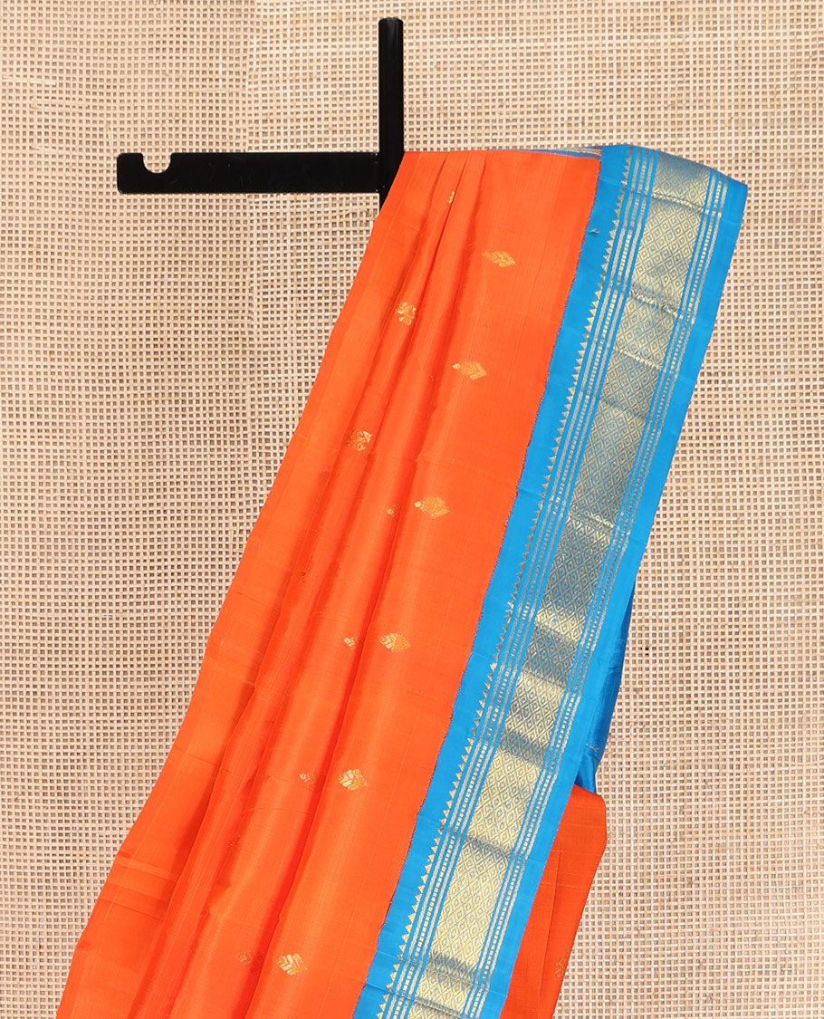 Orange Kanchipuram Silk Saree, Subtly Enriched with Zari Buttas on Its Body, Complemented by Contrast One-Sided Korvai Border of Rekku, Banaras, Muthu, and Mayil Kann Designs, Pallu Depicts Zari Designs, and Comes Without a Blouse