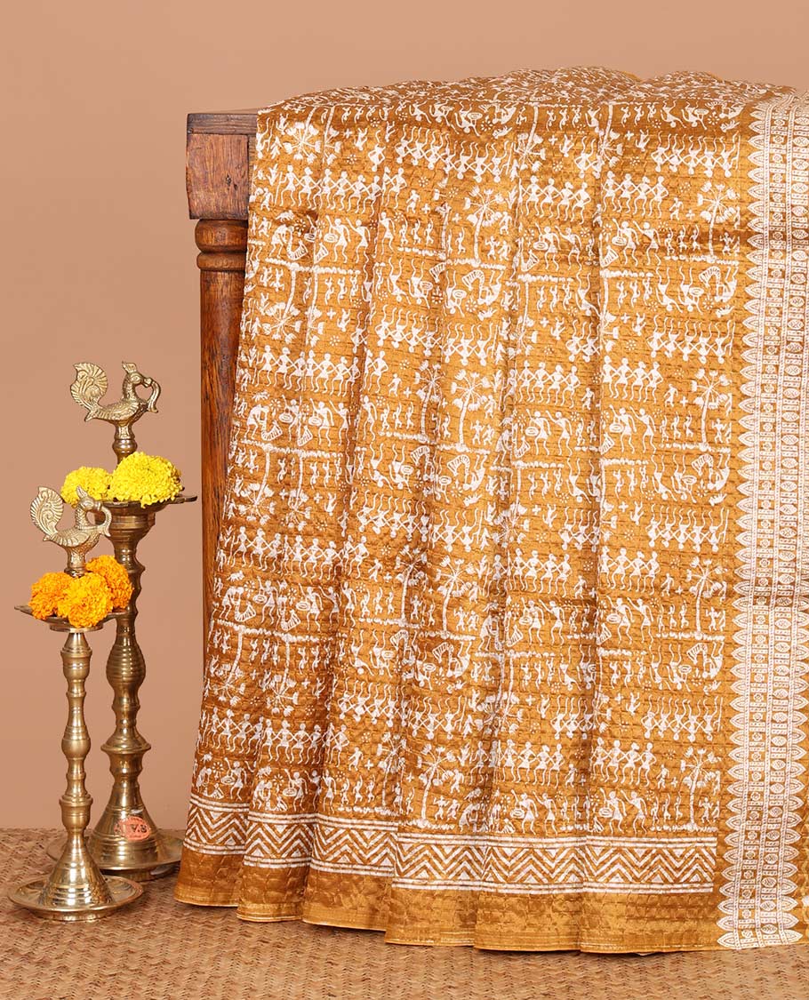 Mustard batik-style warli printed Litch crushed saree, batik chevron border, floral-geometric printed pallu & triangle motif blouse