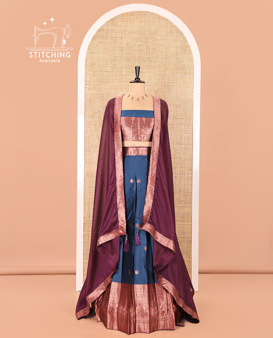 Blue and Purple Semi-Banarasi Half-Saree, Accentuated with Zari Buttas on Its Skirt, Complemented by a Contrast Traditional Zari-Design Border, Paired with a Matching Blouse, and a Contrast Satin Georgette Zari-Bordered Dhavani