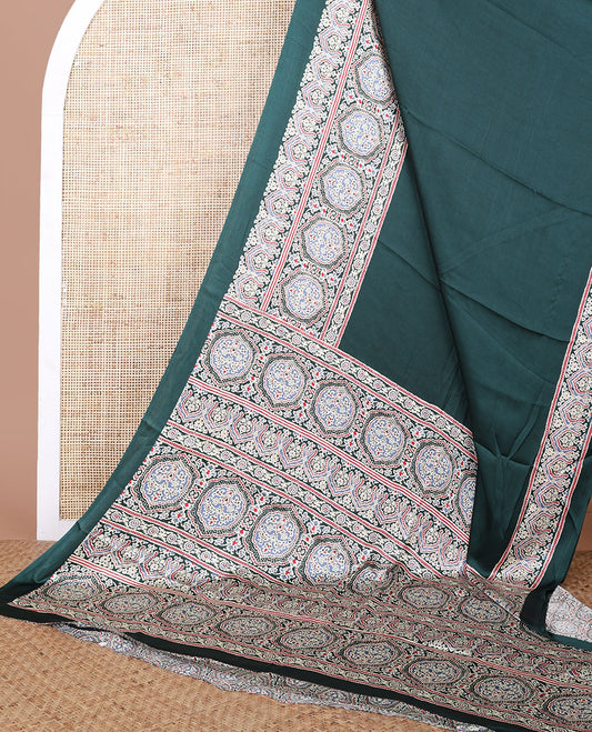 Green modal crepe saree with ajrakh printed border & ajrakh printed pallu along with printed blouse