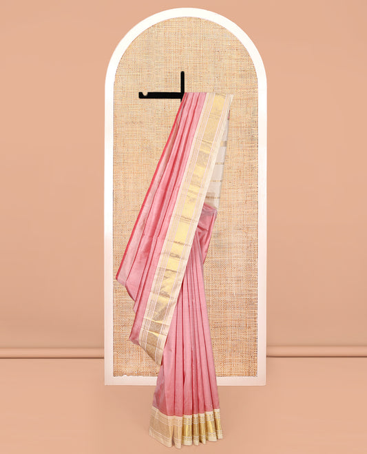 Pink Kanchipuram Silk Saree Featuring Zari Buttas, Complemented by a Contrast One-Sided Border of Panner Sombu, Banaras, and Jaal Design, Zari Design Pallu, and No Blouse
