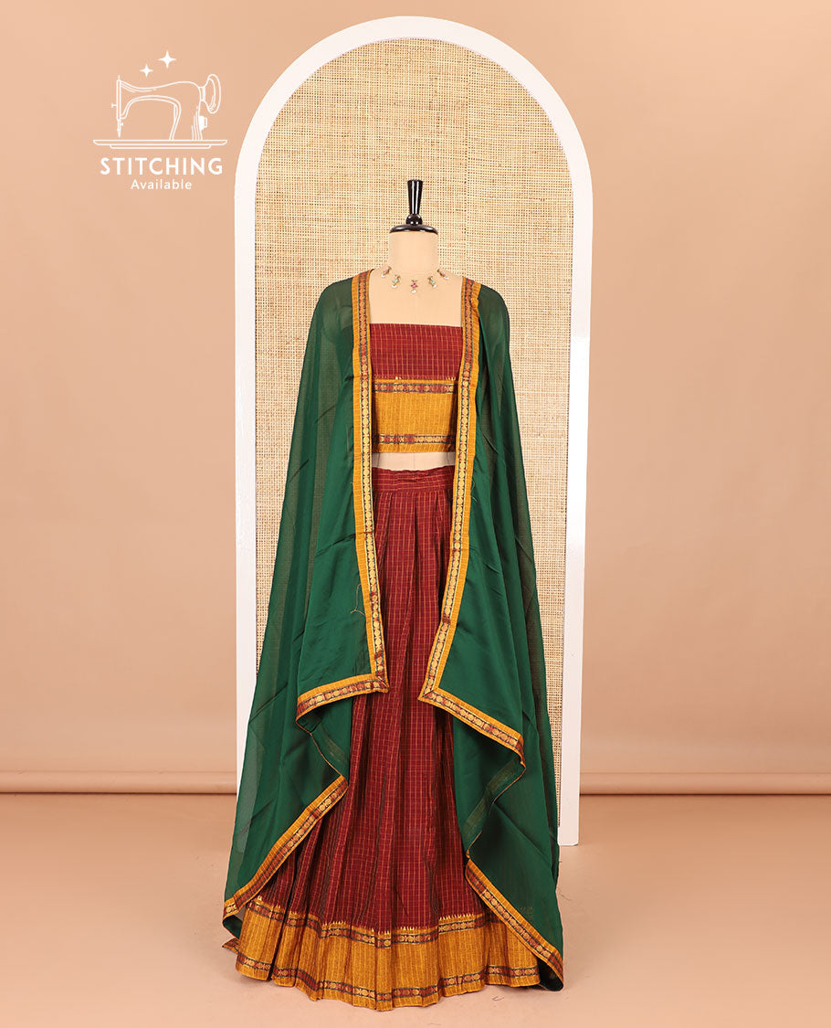 Red half-saree, checked with contrast traditional motifs zari bordered skirt, matching blouse and a contrast zari border plain dhavani