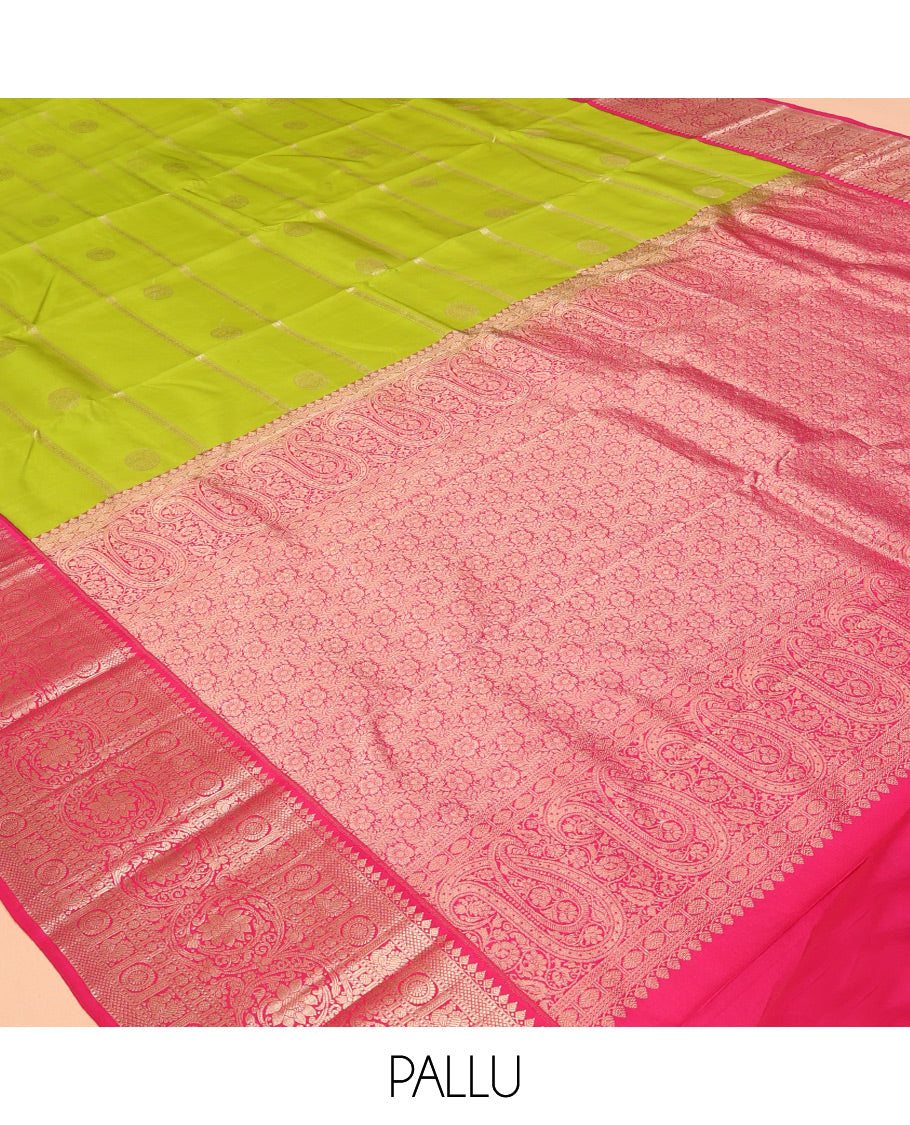 Parrot Green Vasundhara Silk Saree Featuring Veldhari and Round Kuthirai Motifs, Complemented by a Contrast Border of Thilakam Mokku, Muthu, Annam Chakram, and Kodi Visiry Designs, Pallu Elevated with Floral Designs, and Paired with a Contrast Blouse