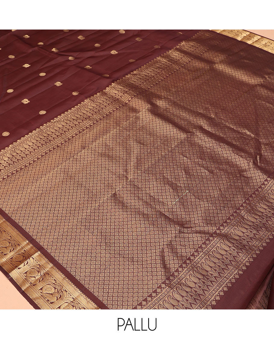 Brown Vasundhara Silk Saree, Enriched with Mayil-Chakram Buttas, a Zari Border of Rekku, Mayil Kann, and Mayil Designs, a Grand Pallu, and a Matching Blouse