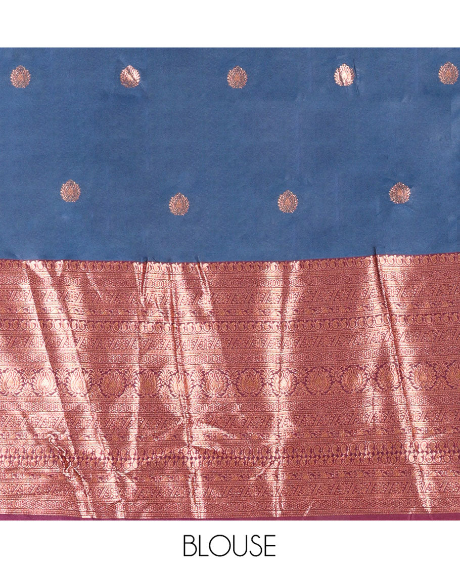 Blue and Purple Semi-Banarasi Half-Saree, Accentuated with Zari Buttas on Its Skirt, Complemented by a Contrast Traditional Zari-Design Border, Paired with a Matching Blouse, and a Contrast Satin Georgette Zari-Bordered Dhavani