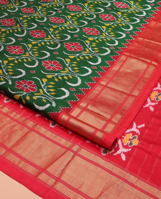 Green Ikkat Silk Saree, Enriched with Ikkat Floral Designs All Over Its Body, Complemented by a Contrast Temple Border of Diamond Zari Designs, Pallu of Floral Ikkat Designs, and Paired with a Contrast Blouse