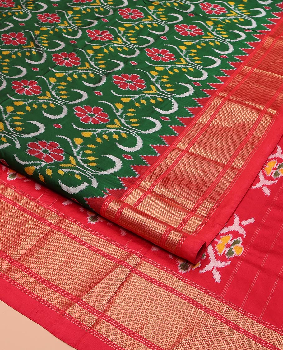 Green Ikkat Silk Saree, Enriched with Ikkat Floral Designs All Over Its Body, Complemented by a Contrast Temple Border of Diamond Zari Designs, Pallu of Floral Ikkat Designs, and Paired with a Contrast Blouse