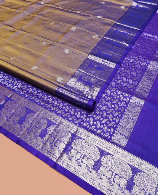 Green Venkatagiri Silk Saree, Enriched with Zari Buttas All Over Its Body, Complemented by a Contrast Traditional Zari Border of Tree Designs, Pallu Steeped with Leaf Designs, and Paired with a Contrast Blouse
