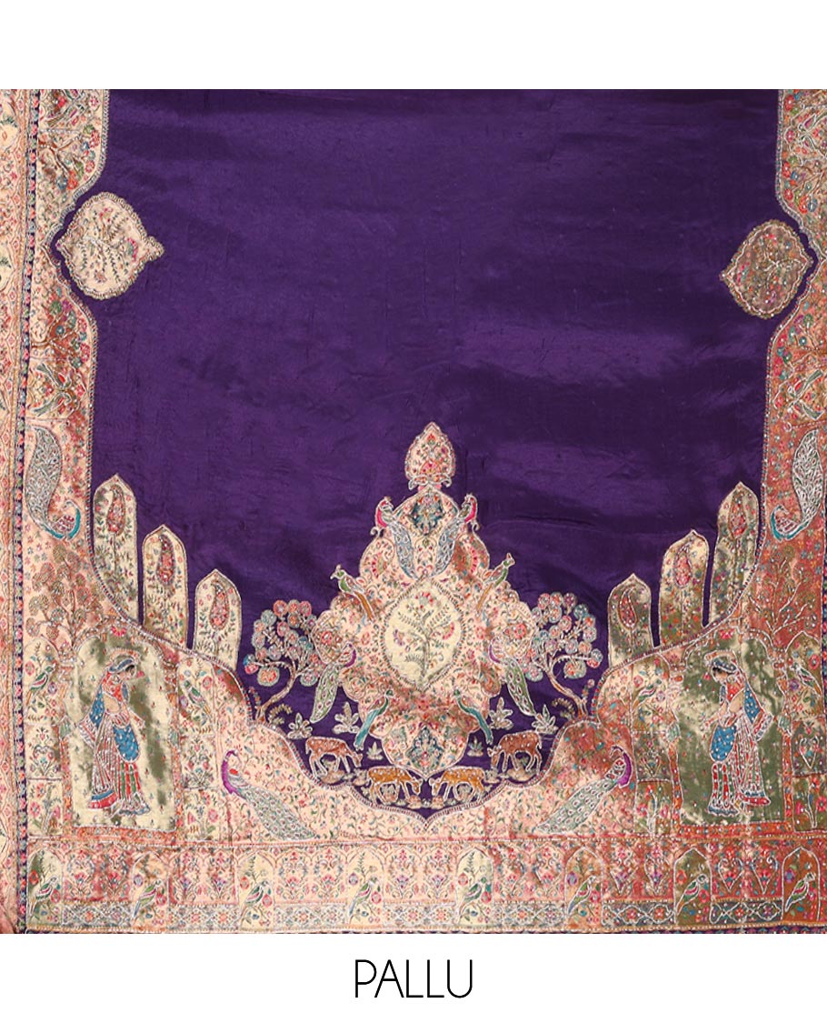 Violet Dola Silk Saree, Uniquely Detailed with Patch Embroidery on Its Body, Highlighted by a Patch Embroidered Border, Pallu Depicts Flora, Fauna, and Human Design Embroidery, and Paired with a Matching Blouse