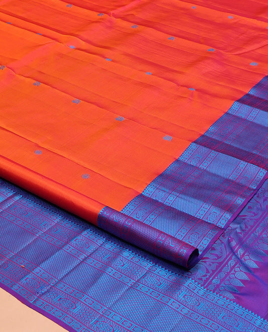 Orange Kanchipuram Silk Saree, Bedecked with Mayil and Chakram Thread Buttas on Its Body, Complemented by a Contrast Border of Rekku, Kamalam, Poun, Chakram, Kuyil Kann, and Then Kuli Kann Designs, Jaal Design Pallu, and Paired with a Contrast Blouse