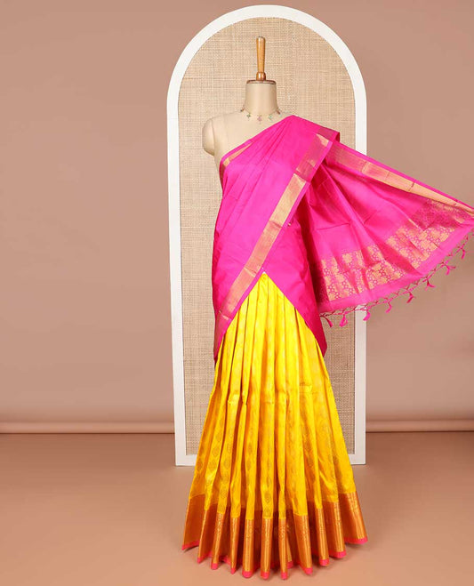 Yellow florl buttas silk half saree with contrast border of thilakam mokku, paun, mayil kann design, zari design border & intricate zari design dhavani