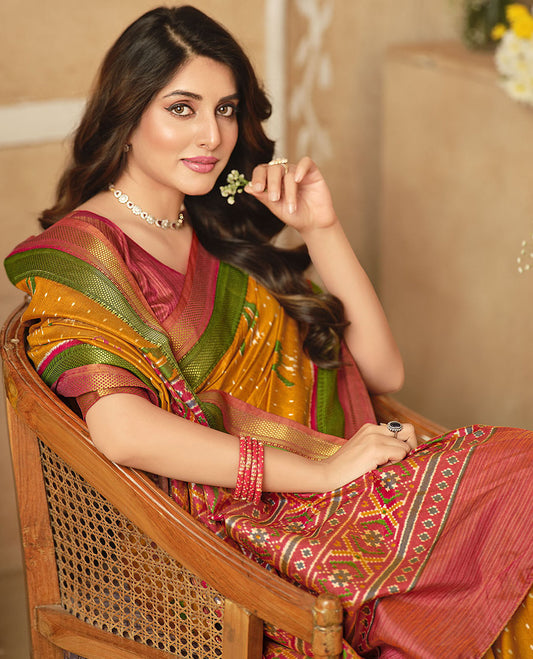 Orange Fancy Raw Silk Designer Saree, Elevated with Ikat Butta and Bird Buttas, a Contrast Traditional Border, a Patola-Printed Pallu, and a Contrast Blouse