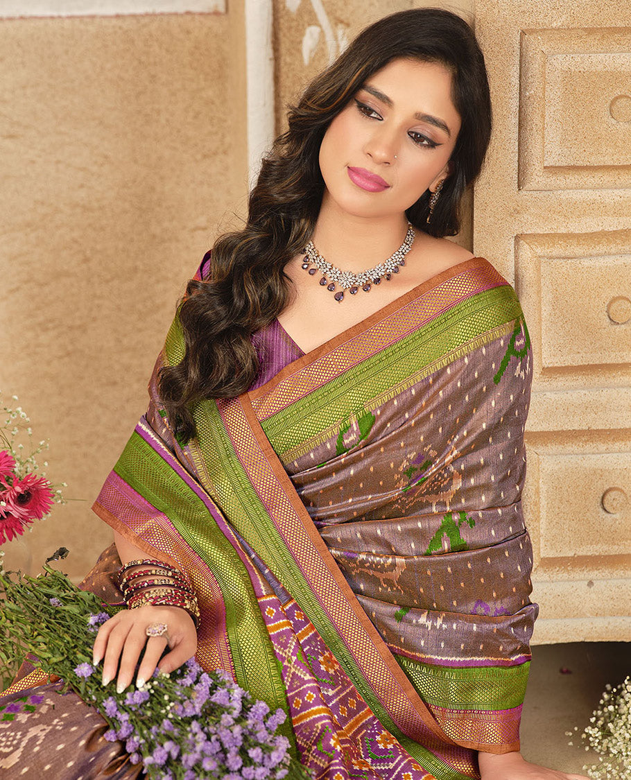 Brown Fancy Raw Silk Designer Saree, Ornamented with Ikat Butta and Bird Buttas, a Contrast Traditional Border, a Patola-Printed Pallu, and a Contrast Blouse