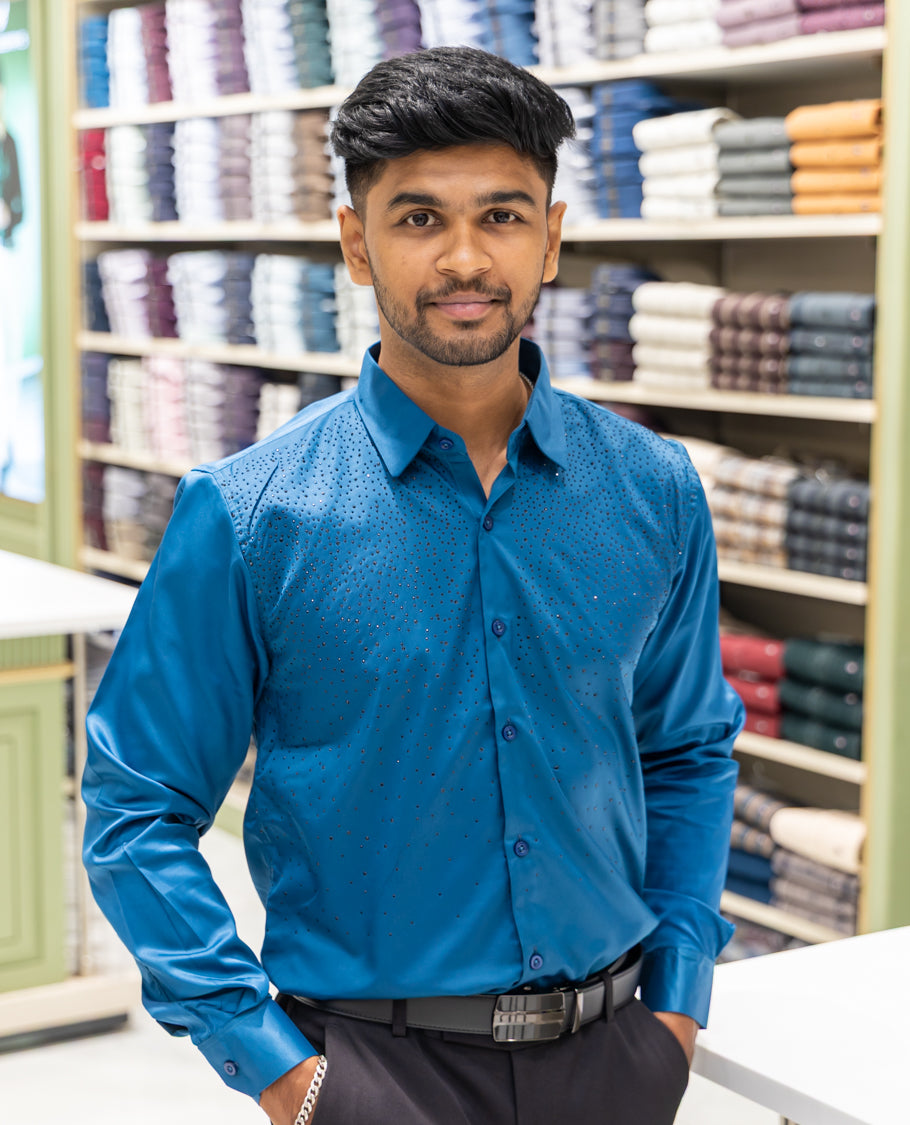 Peacock Blue Poly Satin Party Wear Shirt Features Micro-Stonework, Full Sleeves, a Slim Fit, a Spread Collar, and Regular Length