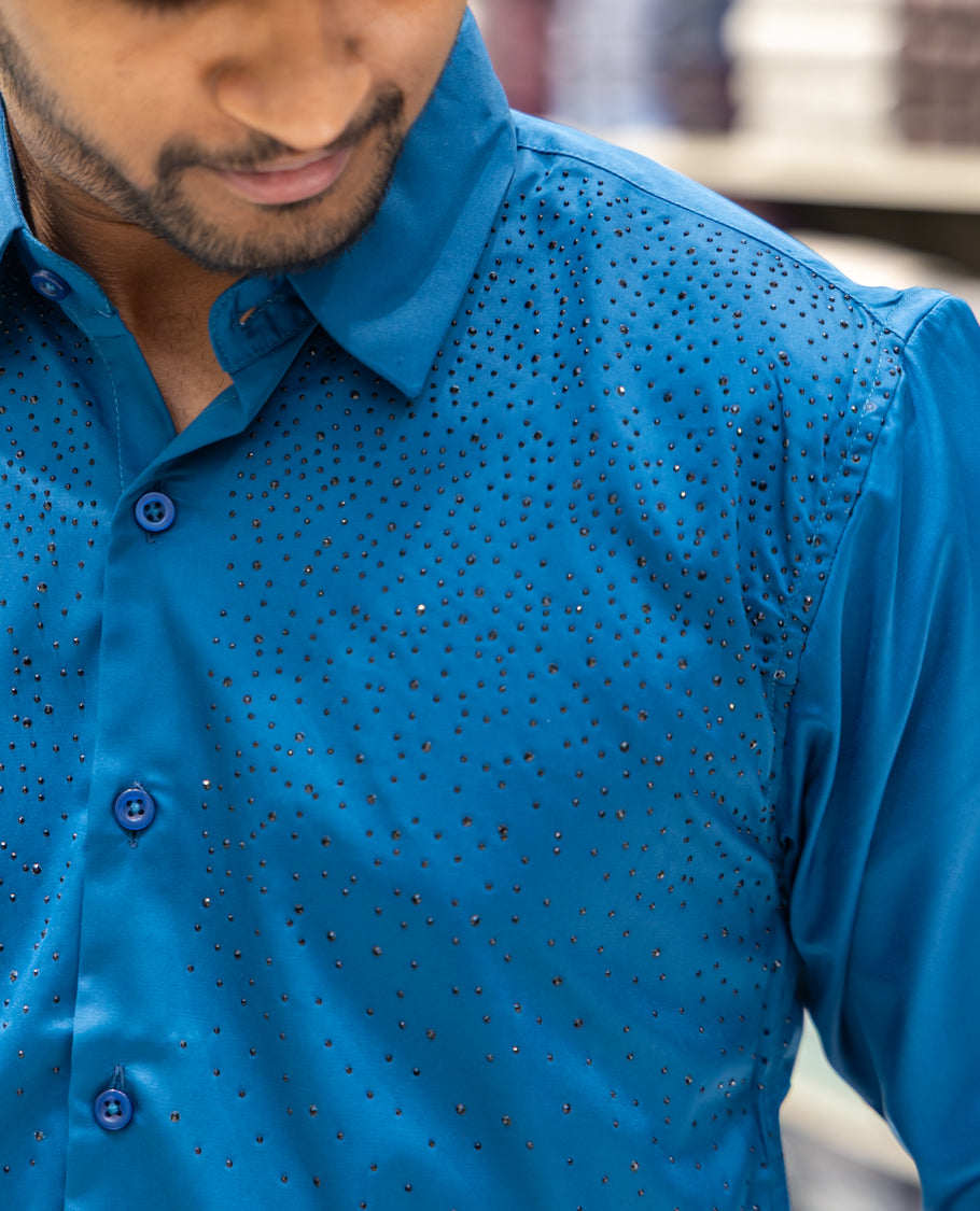 Peacock Blue Poly Satin Party Wear Shirt Features Micro-Stonework, Full Sleeves, a Slim Fit, a Spread Collar, and Regular Length