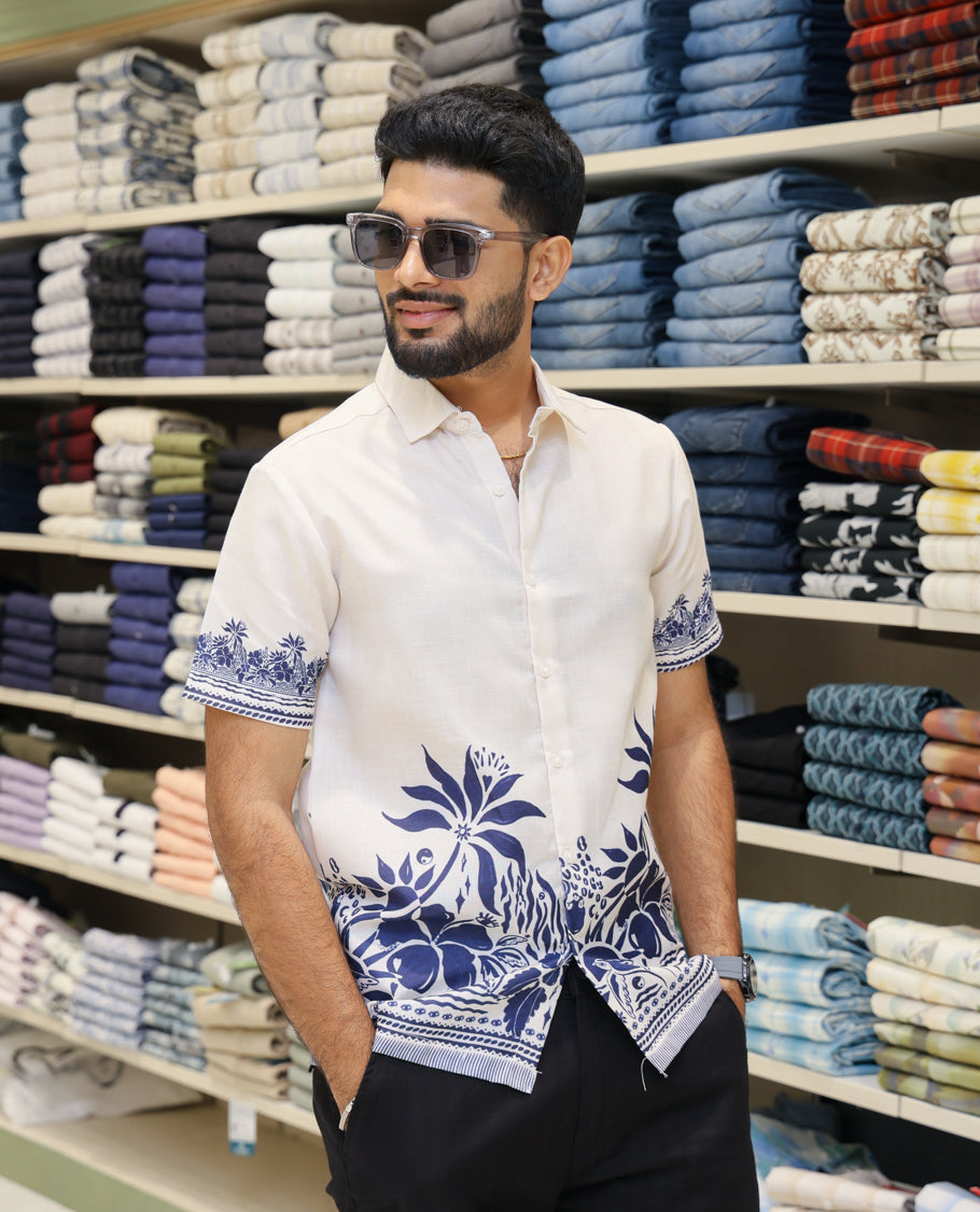 Cream Cotton-Blended Casual Shirt Features Tropical Floral Print, Half-Sleeves, a Spread Collar, Regular Fit and Regular Length 