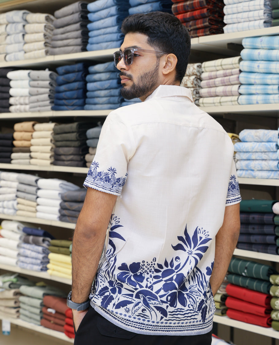 Cream Cotton-Blended Casual Shirt Features Tropical Floral Print, Half-Sleeves, a Spread Collar, Regular Fit and Regular Length 