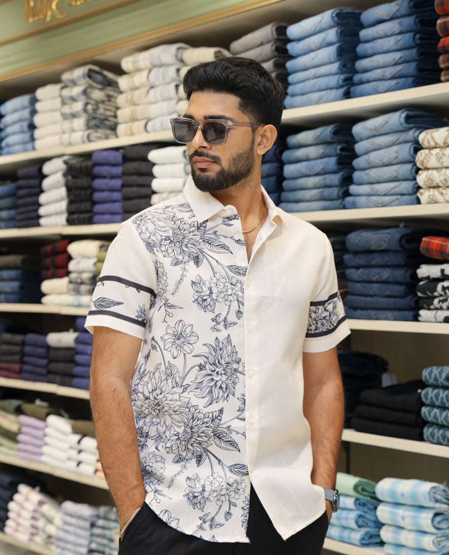 Cream Cotton-Blended Casual Shirt Features Half-and-Half Floral Print, Half-Sleeves, a Spread Collar, Regular Fit and Regular Length 