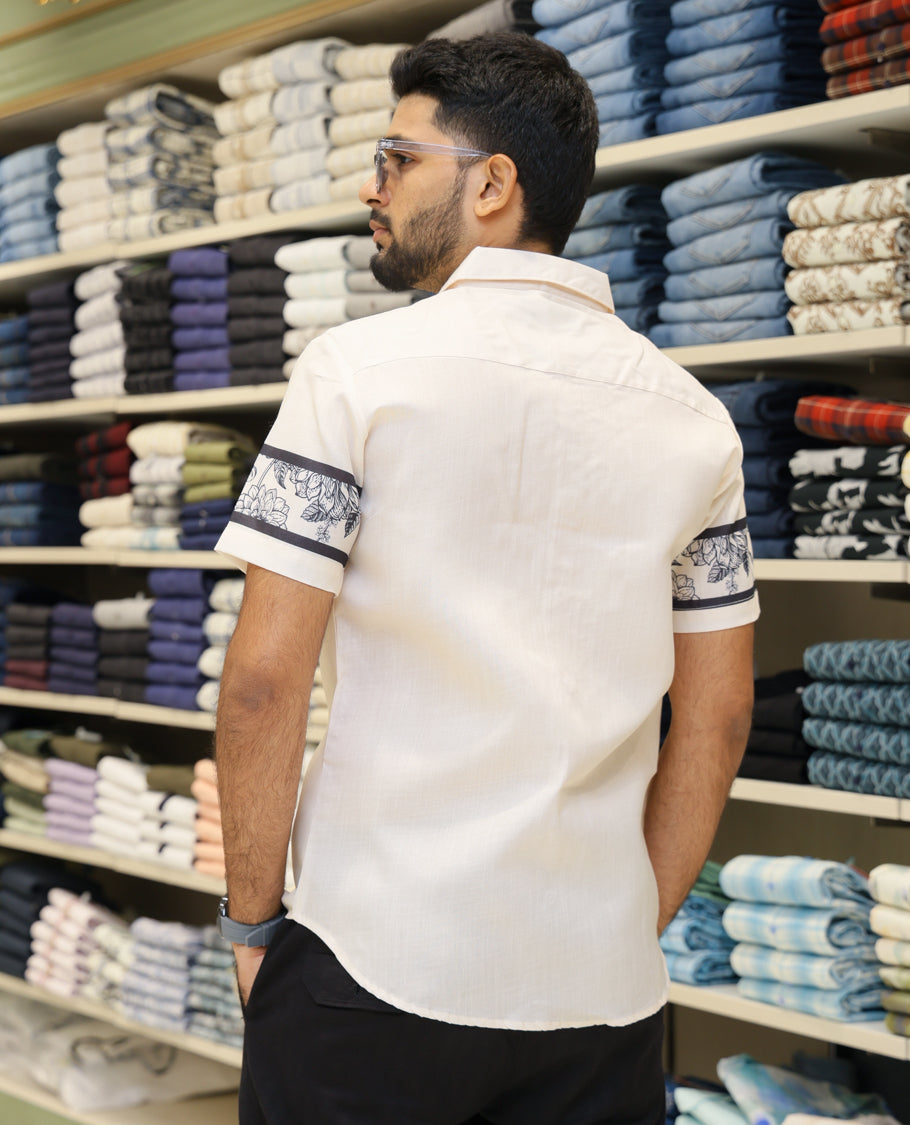 Cream Cotton-Blended Casual Shirt Features Half-and-Half Floral Print, Half-Sleeves, a Spread Collar, Regular Fit and Regular Length 
