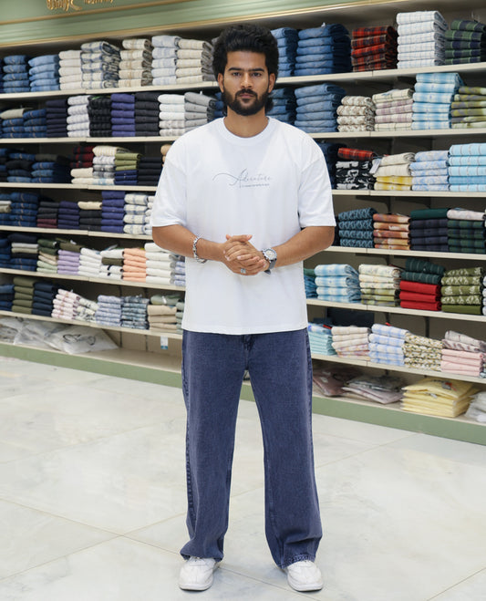 White Cotton-Blended T-shirt Features Funky and Bold Motifs Print, Half-Sleeves, Oversized Fit, Round Neck, and Regular Length 
