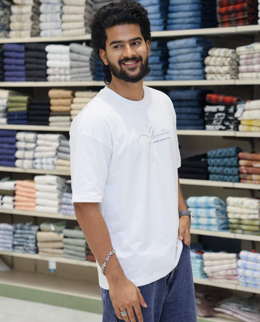 White Cotton-Blended T-shirt Features Funky and Bold Motifs Print, Half-Sleeves, Oversized Fit, Round Neck, and Regular Length