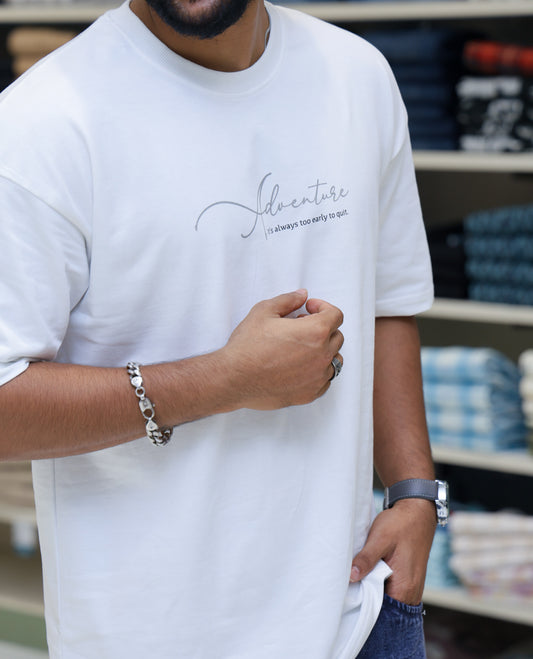 White Cotton-Blended T-shirt Features Funky and Bold Motifs Print, Half-Sleeves, Oversized Fit, Round Neck, and Regular Length 