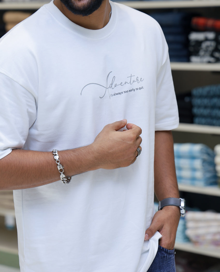 White Cotton-Blended T-shirt Features Funky and Bold Motifs Print, Half-Sleeves, Oversized Fit, Round Neck, and Regular Length