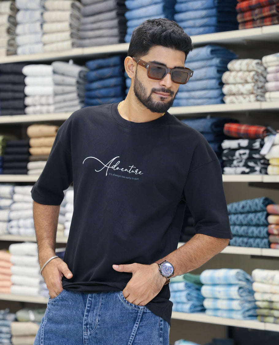 Black Cotton-Blended T-shirt Features Funky and Bold Motifs Print, Half-Sleeves, Oversized Fit, Round Neck, and Regular Length