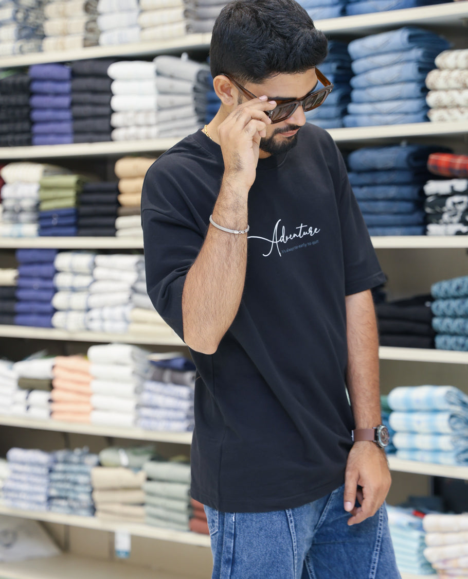 Black Cotton-Blended T-shirt Features Funky and Bold Motifs Print, Half-Sleeves, Oversized Fit, Round Neck, and Regular Length