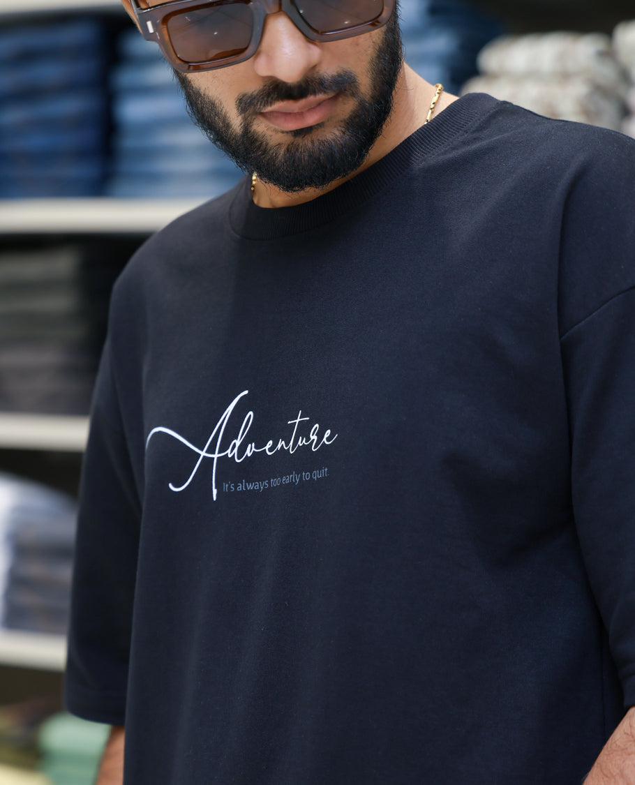 Black Cotton-Blended T-shirt Features Funky and Bold Motifs Print, Half-Sleeves, Oversized Fit, Round Neck, and Regular Length