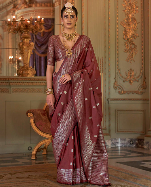 Terracotta Red Designer Catalog Saree Accentuated with Square Buttas All Over Its Body, Highlighted with a Zari Border of Maze-Like Geometric Patterns, Pallu Mirrors Intricate Maze patterns in Zari, and Paired with a Matching Blouse
