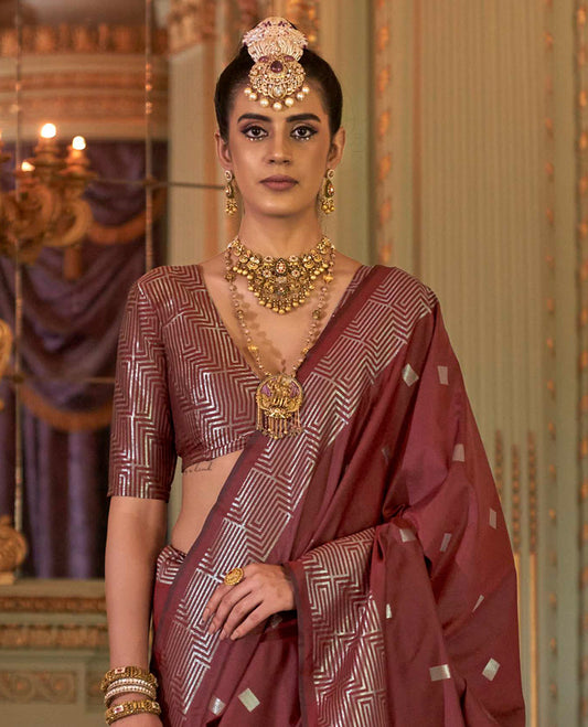 Terracotta Red Designer Catalog Saree Accentuated with Square Buttas All Over Its Body, Highlighted with a Zari Border of Maze-Like Geometric Patterns, Pallu Mirrors Intricate Maze patterns in Zari, and Paired with a Matching Blouse