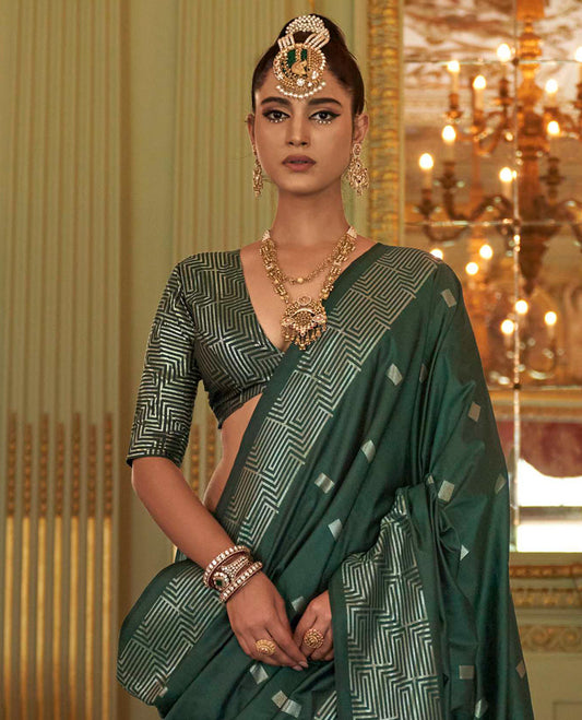 Green Designer Catalog Saree Decked Up with Square Buttas All Over Its Body, Highlighted with a Zari Border of Maze-Like Geometric Patterns, Pallu Mirrors Intricate Maze patterns in Zari, and Paired with a Matching Blouse