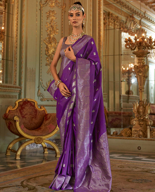 Purple Designer Catalog Saree Bedecked with Square Buttas All Over Its Body, Highlighted with a Zari Border of Maze-Like Geometric Patterns, Pallu Mirrors Intricate Maze patterns in Zari, and Paired with a Matching Blouse