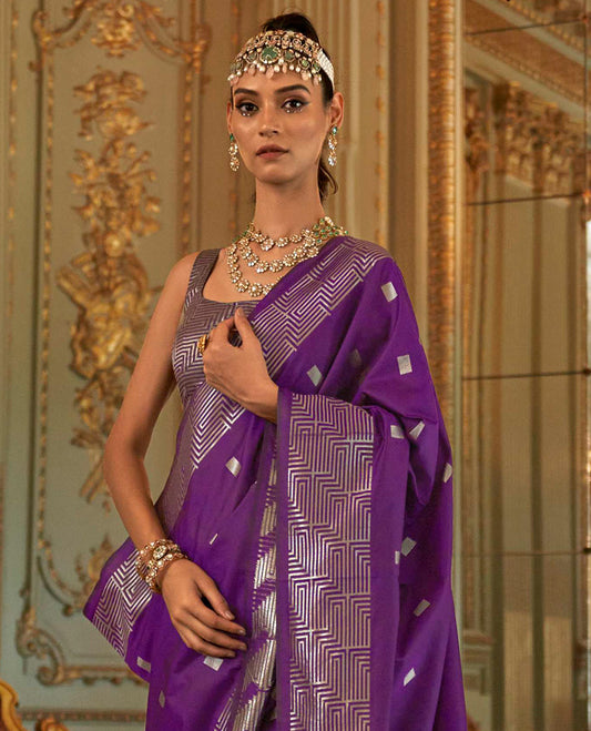 Purple Designer Catalog Saree Bedecked with Square Buttas All Over Its Body, Highlighted with a Zari Border of Maze-Like Geometric Patterns, Pallu Mirrors Intricate Maze patterns in Zari, and Paired with a Matching Blouse
