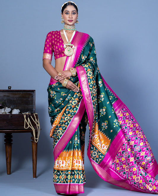 Green patola floral motifs designer saree, contrast temple border, and patola printed pallu