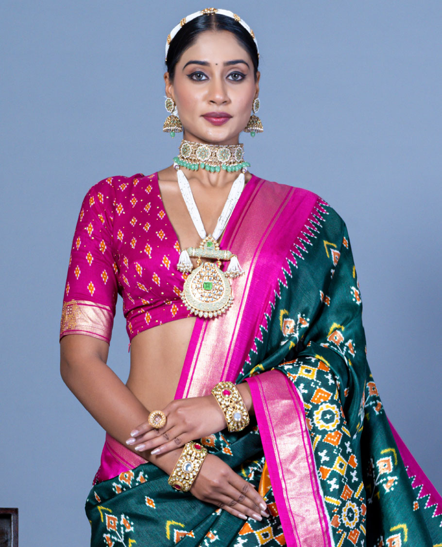 Green patola floral motifs designer saree, contrast temple border, and patola printed pallu