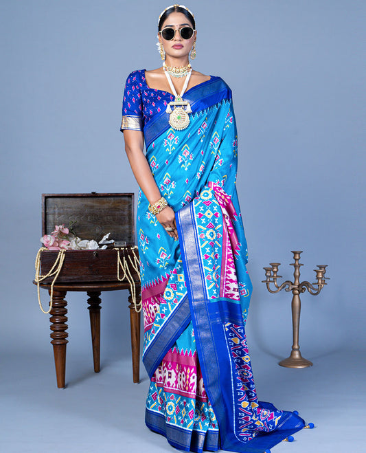 Blue patola floral motifs designer saree, contrast temple border, and patola printed pallu