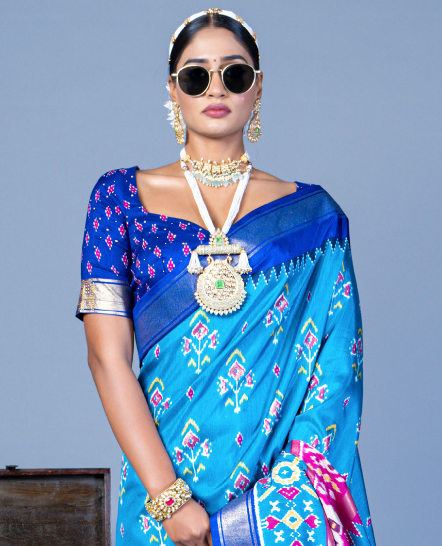 Blue patola floral motifs designer saree, contrast temple border, and patola printed pallu