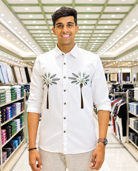 White Cotton-Blended Casual Shirt, Artfully Designed with Palm Tree Motifs Embroidery, Featuring a Spread Collar, Full Sleeves, Slim Fit, and Regular Length