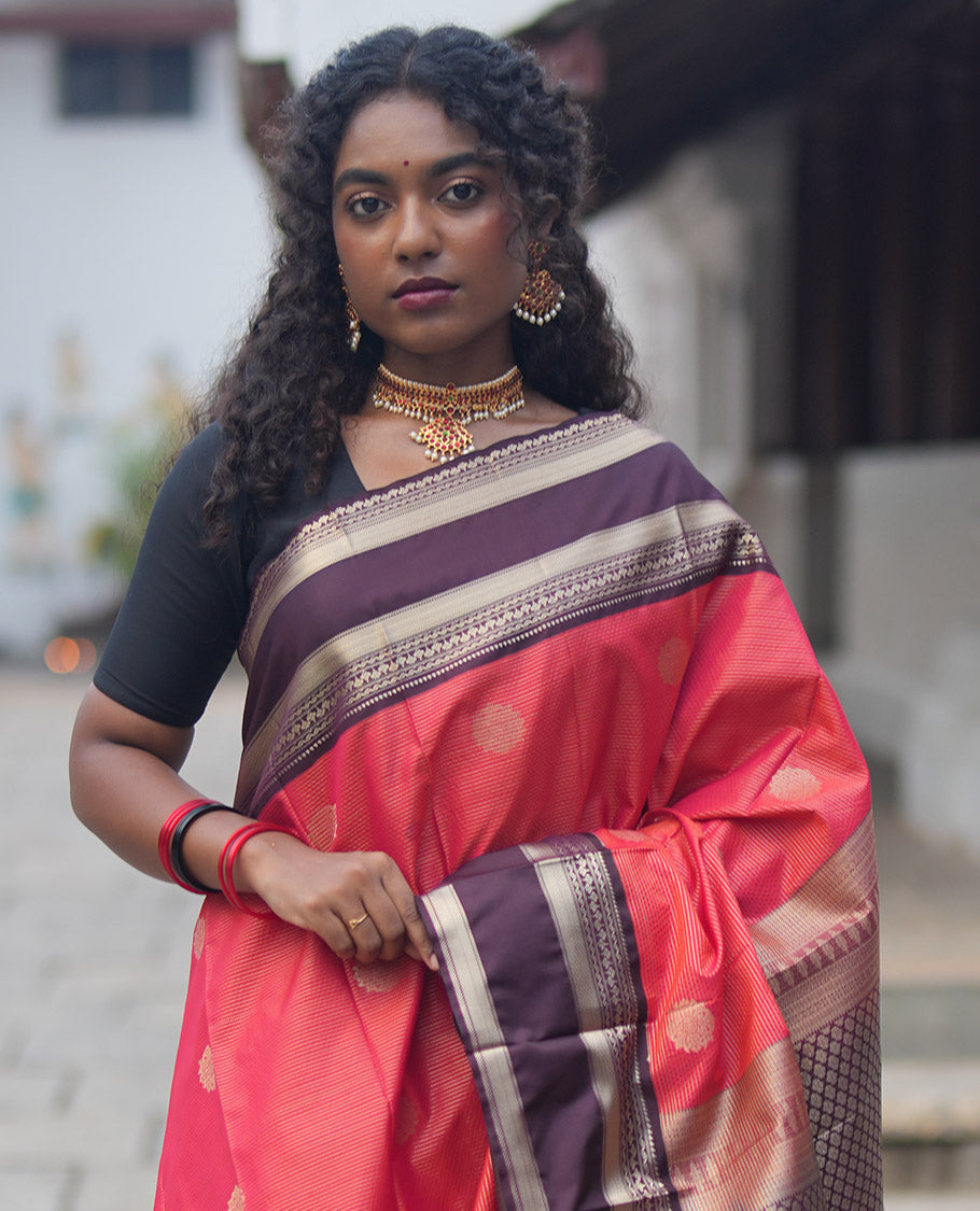 Reddish Orange and Coffee Brown Budget Silk Saree, Ornamented With Zari Buttas and Vaira Oosai Stripes All Over Its Body, Complemented by Contrast Traditional Zari Rettai Pettu Border, Grand Pallu, and Paired with a Contrast Blouse