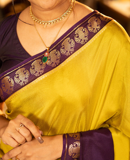 Mustard Plain Dola Silk Saree, Complemented by Contrast Rettai Pettu Ganda Berunda Motifs, Zari Border, Gleaming Zari Striped Pallu, and Paired with a Contrast Blouse