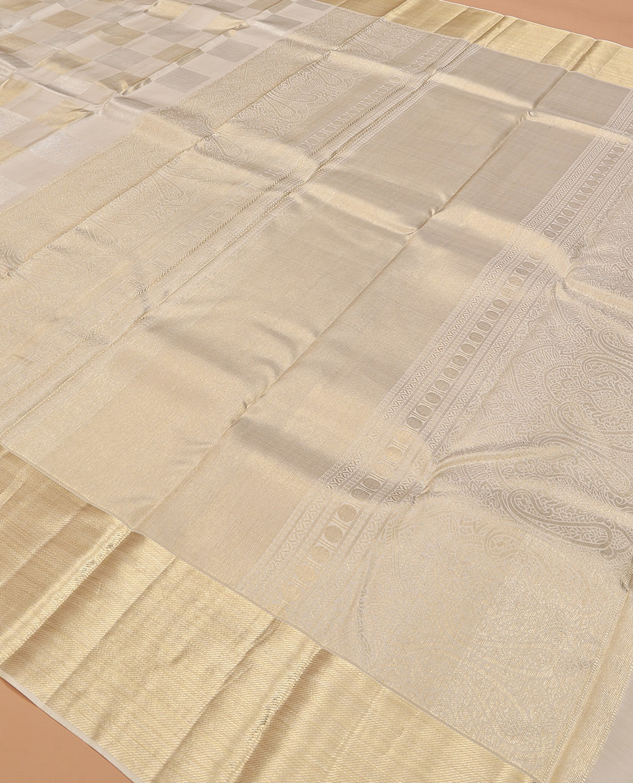 Pearl white base golden and silver zari checked silk saree, getti zari bavanji border, and zari woven pallu