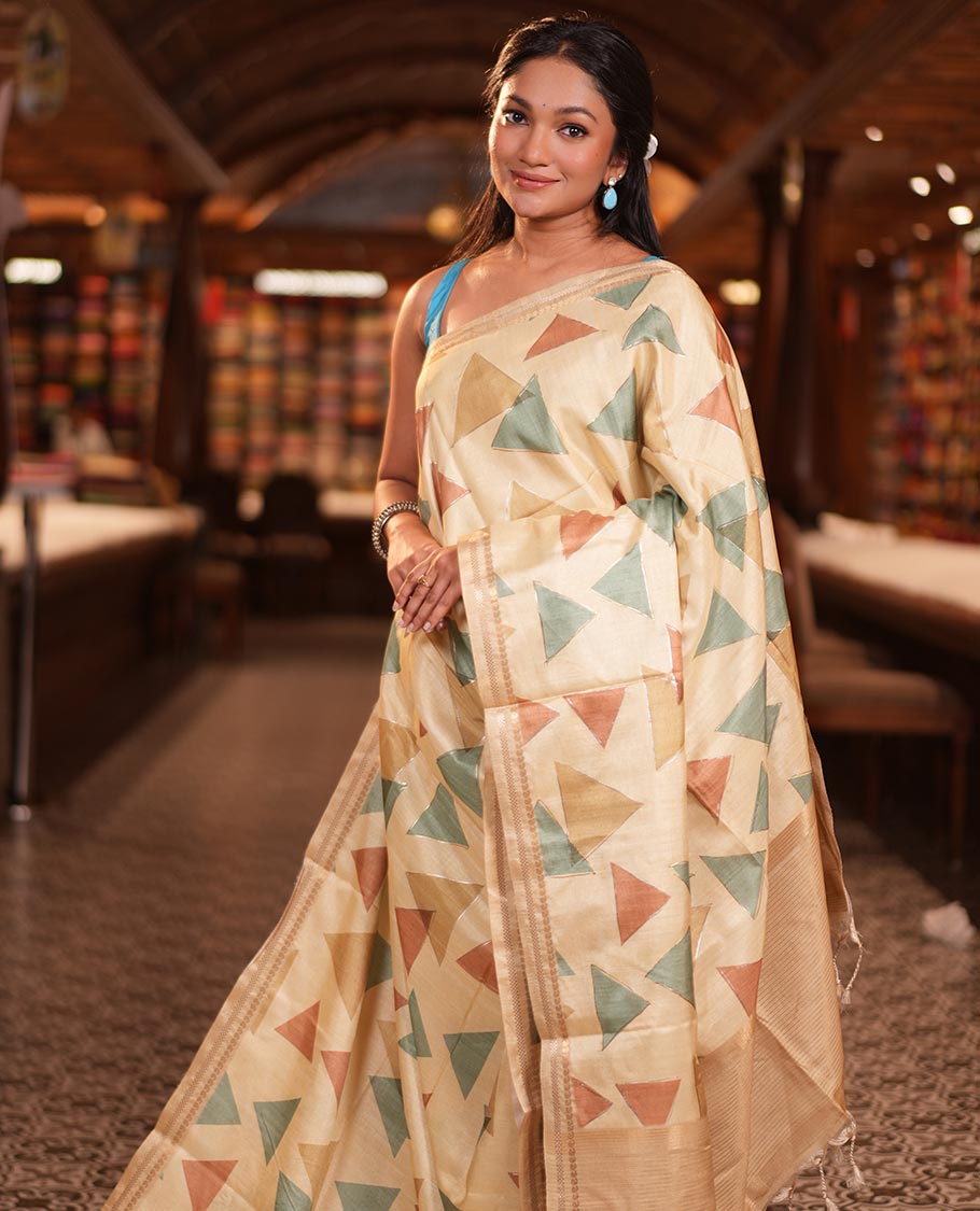 Light Yellow Fancy Tussar Silk Saree Features Triangle Motifs, Zari Border, Striped Pallu, Matching Blouse