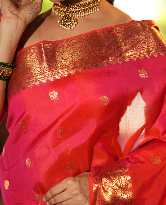 Pink Vasundhara Lite Silk Mix Saree, Artfully Detailed with Mayil-Chakram Buttas and Zari Checks All Over Its Body, Highlighted by a Zari Border of Thazampoo Rekkum, Paisa, Mayil, and Chakram Designs, a Grand Pallu, and Paired with a Matching Blouse