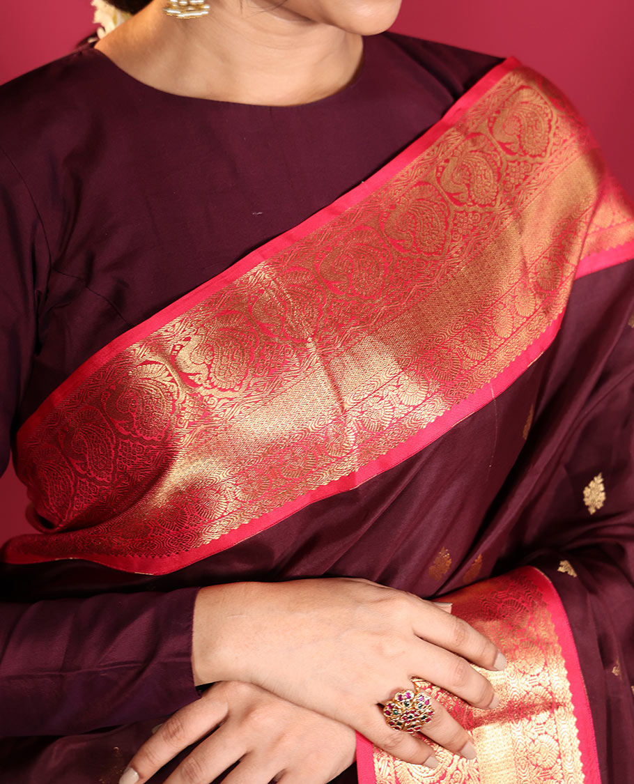 Brown Vasundhara Silk Saree, Decorated with Zari Buttas on Its Body, Complemented by a Contrast Traditional Zari Border of Mayil Designs, Grand Pallu Depicts Jaal and Floral Designs, and Paired with a Contrasting Blouse